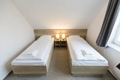 Ein Bett oder Betten in einem Zimmer der Unterkunft Cuxlandhotel Studio 124