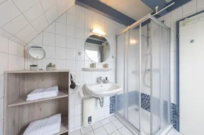 Ein Badezimmer in der Unterkunft Ferienhaus Vogelsand 02