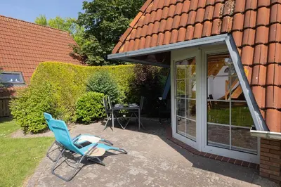 Ein Garten an der Unterkunft Ferienhaus Knechtsand 30