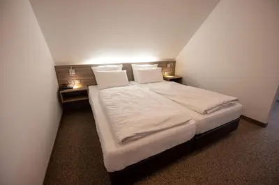 Ein Bett oder Betten in einem Zimmer der Unterkunft Cuxlandhotel Studio 203