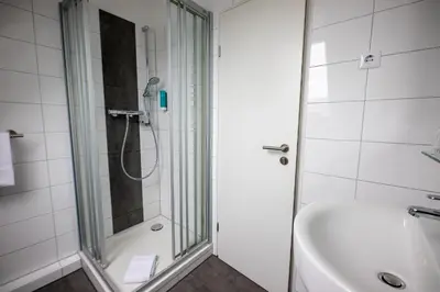 Ein Badezimmer in der Unterkunft Cuxlandhotel Studio 203
