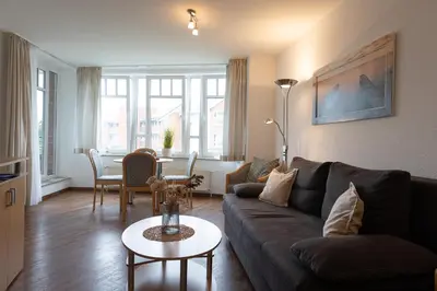 Ein Sitzbereich in der Unterkunft Appartement Kormoranweg 42-203