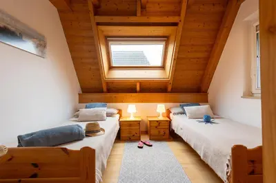 Ein Bett oder Betten in einem Zimmer der Unterkunft Ferienhaus Wittsand 30
