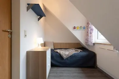 Ein Bett oder Betten in einem Zimmer der Unterkunft Ferienwohnung Sieltrift 4-13