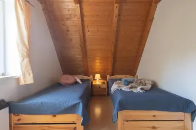 Ein Bett oder Betten in einem Zimmer der Unterkunft Ferienhaus Vogelsand 10