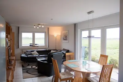 Ein Sitzbereich in der Unterkunft Ferienhaus Kiebitzmoor 7