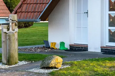 Ein Garten an der Unterkunft Ferienhaus Westertill 14