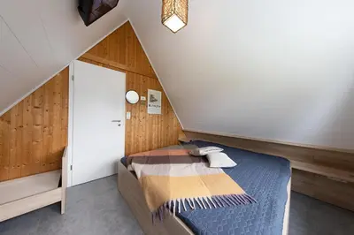 Ein Bett oder Betten in einem Zimmer der Unterkunft Ferienhaus 
