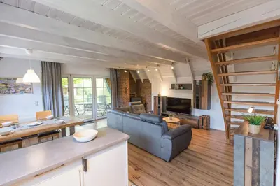 Ein Sitzbereich in der Unterkunft Ferienhaus Opi Huck Stroot 42