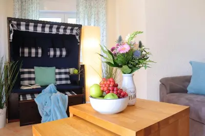 Ein Sitzbereich in der Unterkunft Ferienhaus Strandkorb