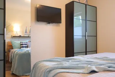 Ein Bett oder Betten in einem Zimmer der Unterkunft Ferienhaus Strandkorb