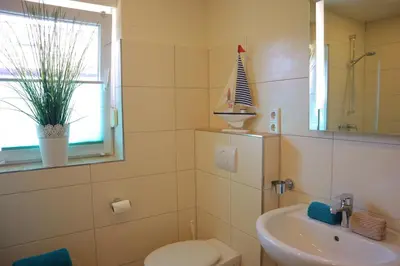 Ein Badezimmer in der Unterkunft Ferienhaus Strandkorb