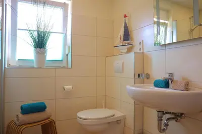 Ein Badezimmer in der Unterkunft Ferienhaus Strandkorb
