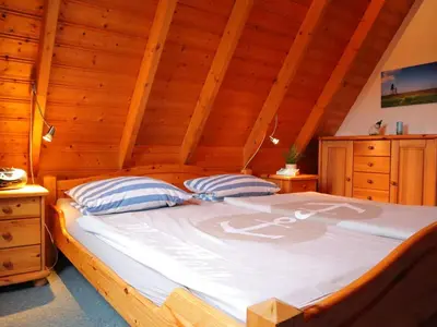 Ein Bett oder Betten in einem Zimmer der Unterkunft Ferienhaus MoinMoin