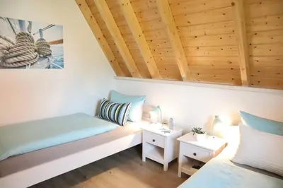 Ein Sitzbereich in der Unterkunft Ferienhaus Zimmers-Nordseehaus