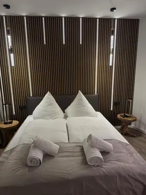Ein Bett oder Betten in einem Zimmer der Unterkunft Strandjuwel in der Seehütte Cuxhaven Duhnen- Exclusive Ferienwohnung am Strand mit Meerblick