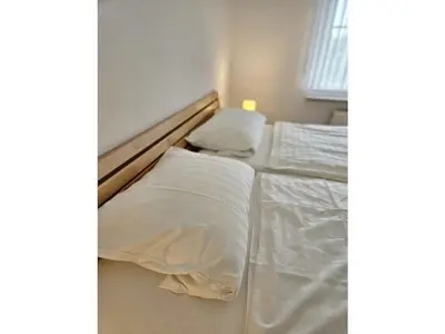 Ein Bett oder Betten in einem Zimmer der Unterkunft Haus Nordseewind XL - Apartment 3
