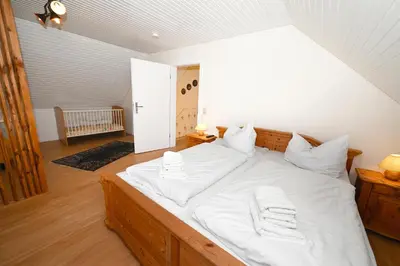 Ein Bett oder Betten in einem Zimmer der Unterkunft Ferienhaus Herzmuschel