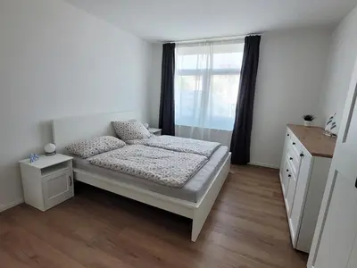 Ein Bett oder Betten in einem Zimmer der Unterkunft Residenz Strandhaus Döse