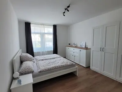 Ein Bett oder Betten in einem Zimmer der Unterkunft Residenz Strandhaus Döse