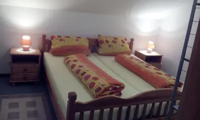 Ein Bett oder Betten in einem Zimmer der Unterkunft Ferienwohnung Sievers