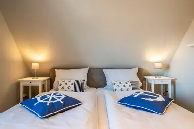 Ein Bett oder Betten in einem Zimmer der Unterkunft Op de Westerwarft Wohnung 5