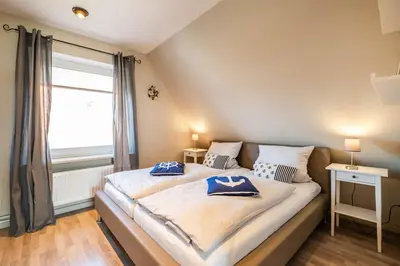 Ein Bett oder Betten in einem Zimmer der Unterkunft Op de Westerwarft Wohnung 5