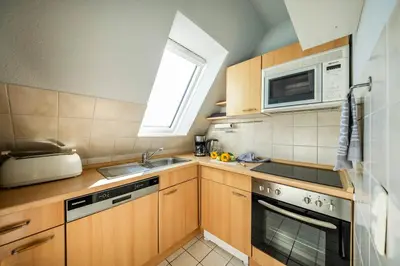 Küche/Küchenzeile in der Unterkunft Op de Westerwarft Wohnung 5