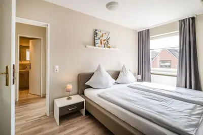 Ein Bett oder Betten in einem Zimmer der Unterkunft Op de Westerwarft Wohnung 3