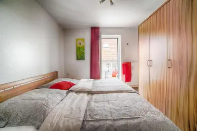 Ein Bett oder Betten in einem Zimmer der Unterkunft Robbenplate, Whng. 18