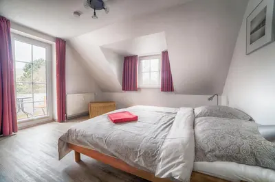 Ein Bett oder Betten in einem Zimmer der Unterkunft Elbstrom, Ferienwohnung 27
