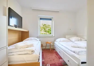 Ein Bett oder Betten in einem Zimmer der Unterkunft Utspannen
