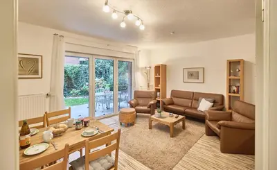 Ein Sitzbereich in der Unterkunft Anlage Am Wehrberg - Wohnung Eule