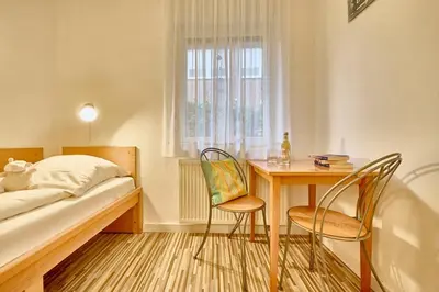 Ein Bett oder Betten in einem Zimmer der Unterkunft Anlage Am Wehrberg - Wohnung Eule