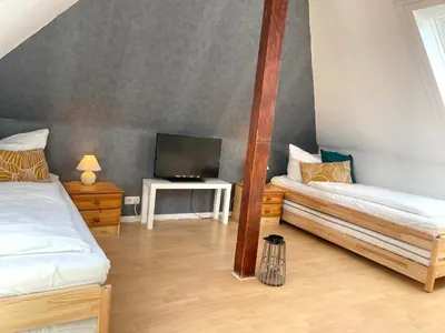 Ein Bett oder Betten in einem Zimmer der Unterkunft Nige Ooge FeWo 6