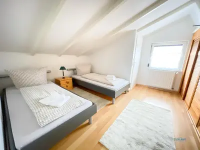Ein Bett oder Betten in einem Zimmer der Unterkunft Elise am Meer - Ringwall 107