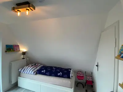 Ein Bett oder Betten in einem Zimmer der Unterkunft Hus Heideblick -zwischen Natur und Nordsee-