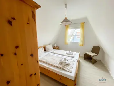 Ein Bett oder Betten in einem Zimmer der Unterkunft Ferienhaus Am Ringwall 36
