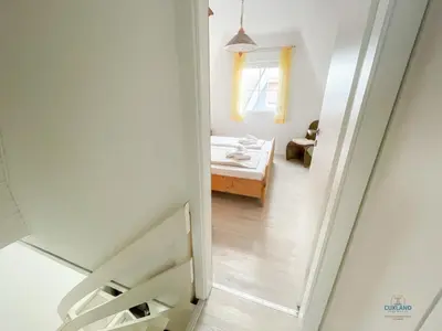 Ein Bett oder Betten in einem Zimmer der Unterkunft Ferienhaus Am Ringwall 36