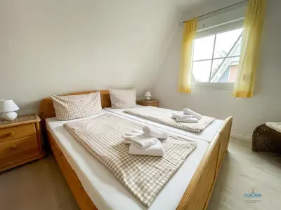 Ein Bett oder Betten in einem Zimmer der Unterkunft Ferienhaus Am Ringwall 36