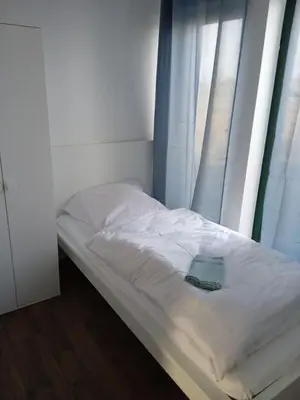 Ein Bett oder Betten in einem Zimmer der Unterkunft Große Landhauswohnung