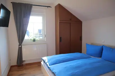 Ein Bett oder Betten in einem Zimmer der Unterkunft Ferienhaus Chalet Bel Air