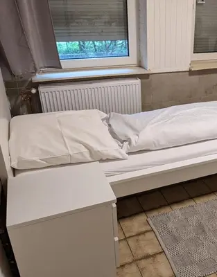 Ein Bett oder Betten in einem Zimmer der Unterkunft Monteurwohnung bei Covestro & Yara