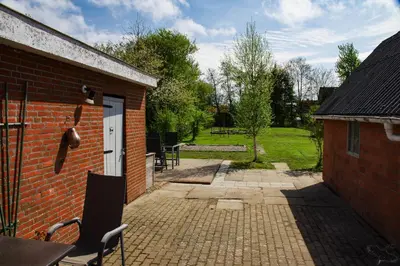 Ein Garten an der Unterkunft Ferienhaus Nordische Ruhe