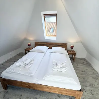 Ein Bett oder Betten in einem Zimmer der Unterkunft Voßhörn 22a
