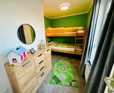 Ein Bett oder Betten in einem Zimmer der Unterkunft Lüttje Deichvilla Backbord