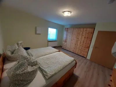 Ein Bett oder Betten in einem Zimmer der Unterkunft Ferienhaus Auenland