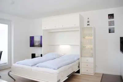 Ein Bett oder Betten in einem Zimmer der Unterkunft Hanseatic 602