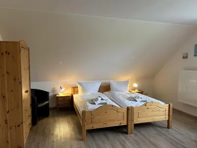 Ein Bett oder Betten in einem Zimmer der Unterkunft Ferienhof am Meer