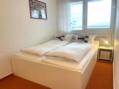 Ein Bett oder Betten in einem Zimmer der Unterkunft Frische Brise FeWo 03 09